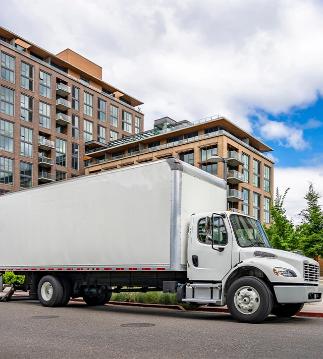 semi truck with box trailer standing on urban street